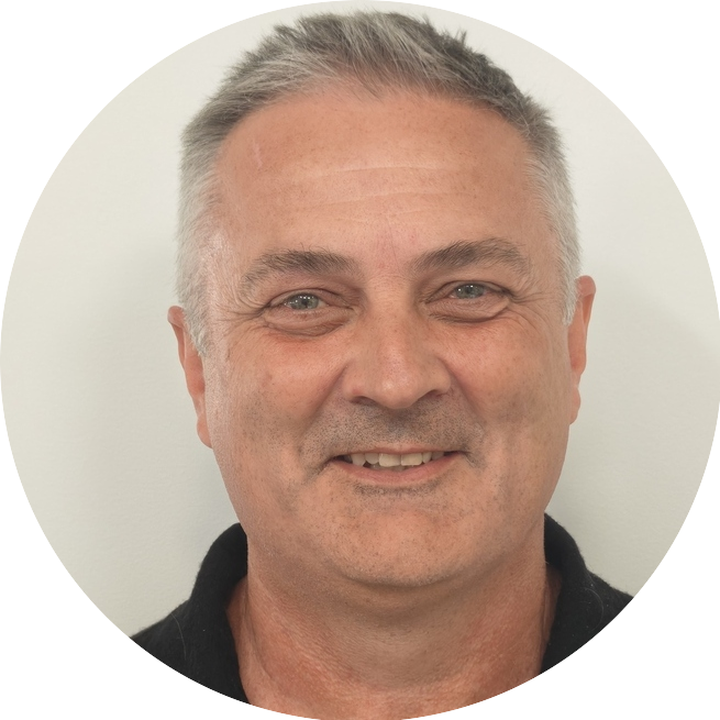 Portrait of Laurence, a team member at OptimySME, smiling in a professional setting.