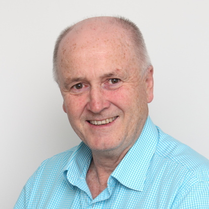 Portrait of Kevin, a team member at OptimySME, smiling in a professional setting.