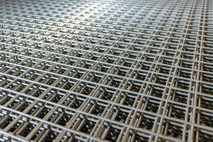 Steel pipes arranged for industrial use, with focus on the alignment and material of the pipes