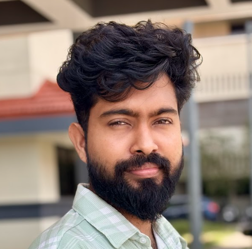 Portrait of Bhabin, a team member at OptimySME, smiling in a professional setting.