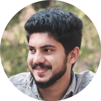 Portrait of Vibin, a team member at OptimySME, smiling in a business environment.