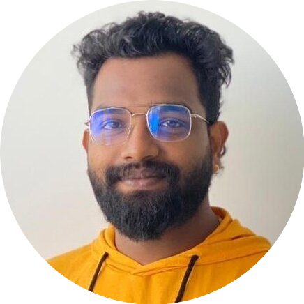 Portrait of Abhishek, a team member at OptimySME, smiling in a business environment.