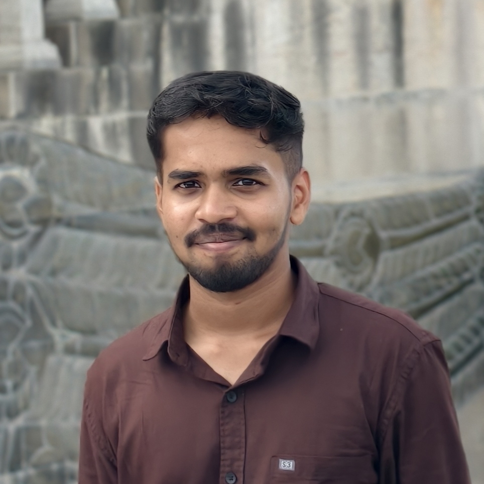 Portrait of Maneesh, a team member at OptimySME, smiling in a professional setting.