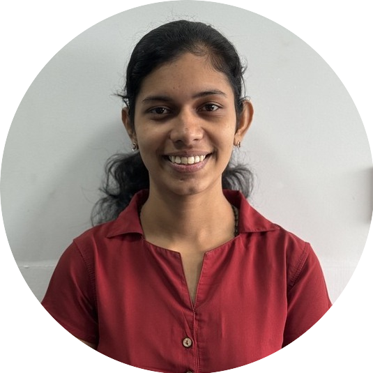 Portrait of Maya, a team member at OptimySME, smiling in a professional setting.