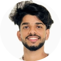 Portrait of Abhijith, a team member at OptimySME, smiling in a business environment.